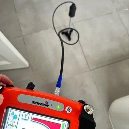 acoustic leak detection device used to locate hidden water leak in bathroom floor